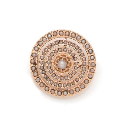 null A circular design with a half pearl (untested) in its center in a triple surround...