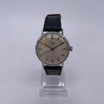 null OMEGA AROUND 1960. Stainless steel wristwatch. White dial signed. Applied baton...