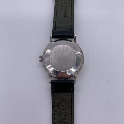 null OMEGA AROUND 1960. Stainless steel wristwatch. White dial signed. Applied baton...