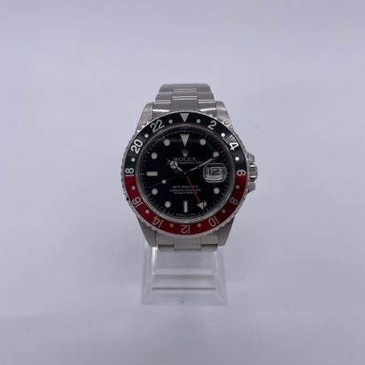 null ROLEX GMT-MASTER II "Coke" Ref. 16710. circa 1998. N° U584XXX. Steel wristwatch...