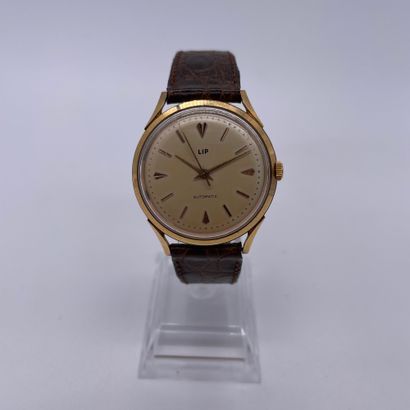 null LIP CIRCA 1960. Ref : 34652. Yellow gold bracelet watch 750/1000. Champagne...