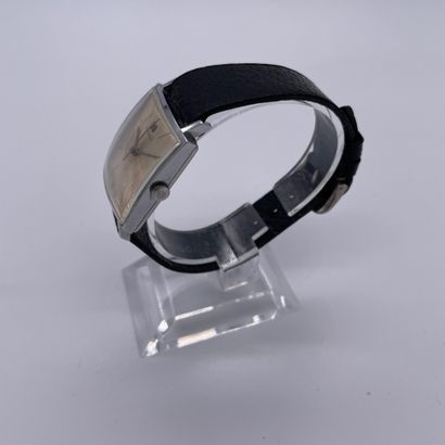 null TISSOT CIRCA 1970. Steel bracelet watch, square case. Cream dial. Painted baton...
