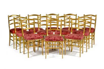 null SET OF TWELVE CHAIRS with openwork backs and gilded wood bars, the belts slightly...