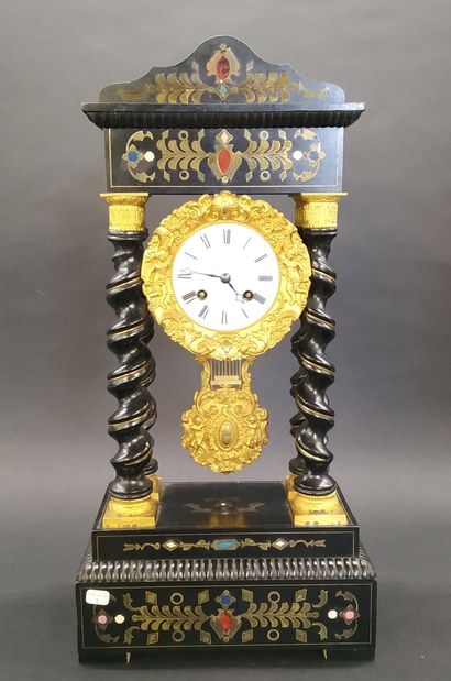 null NAPOLEON III CLOCK

in blackened wood, with twisted columns, decorated with...