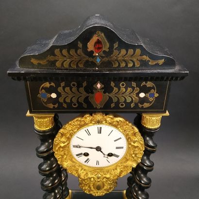 null NAPOLEON III CLOCK

in blackened wood, with twisted columns, decorated with...