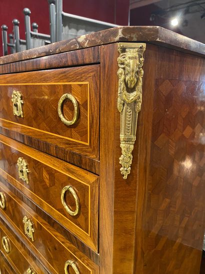 null Wooden veneer and amaranth cabinet. It has seven drawers in front of it, the...