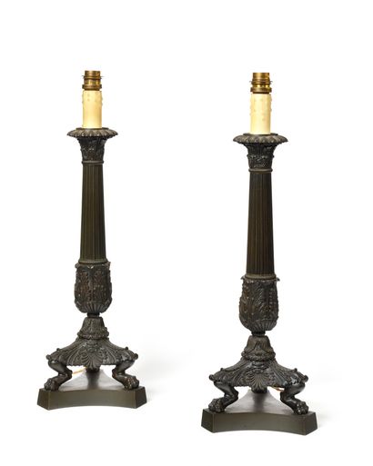 A Pair of patinated bronze corkscrews, the...