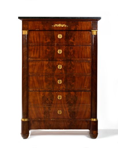 A mahogany veneered cabinet with seven drawers...