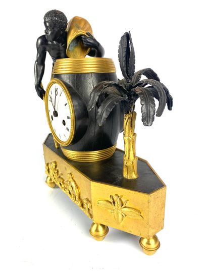  A gilt bronze and patinated bronze "coffee bag" clock representing a torso and barefoot...