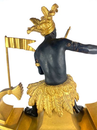 null Gilt bronze and patinated bronze "Amerindian hunter" clock symbolizing the discovery...