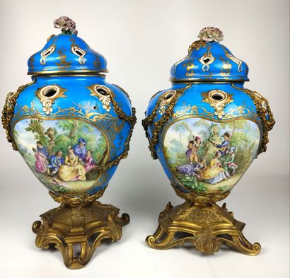 null SEVRES (in the taste of) A pair of blue and gold porcelain covered perfume burners...