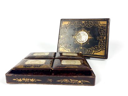 null A lacquered token box with mother-of-pearl blazons comprising four small boxes...