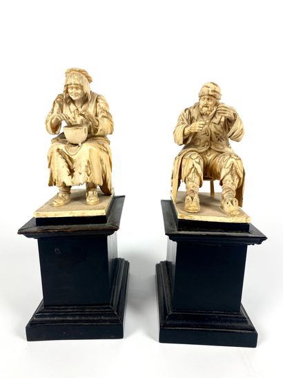 null Pair of finely carved ivory groups representing beggars after Jacques CALLOT....