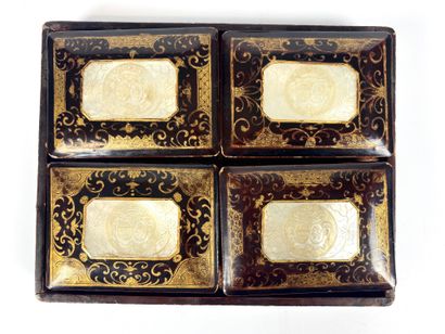 null A lacquered token box with mother-of-pearl blazons comprising four small boxes...