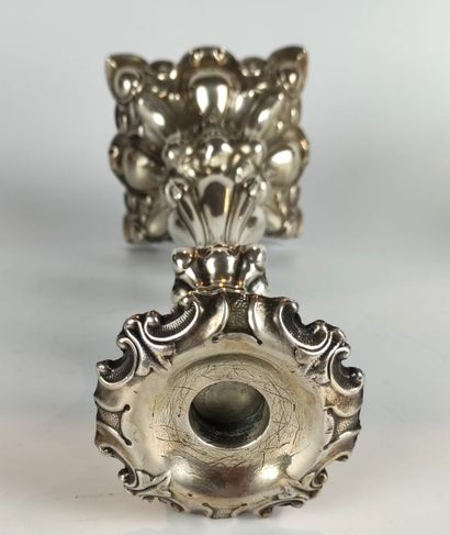 null A silver baluster candlestick with foliage decoration. Goldsmith : M. JARRA...