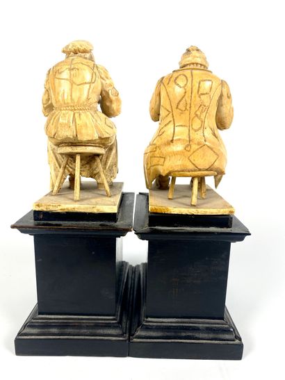 null Pair of finely carved ivory groups representing beggars after Jacques CALLOT....