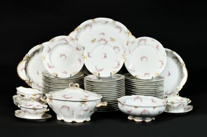 null LIMOGES Part of a white and gold porcelain dinner service decorated with bouquets...