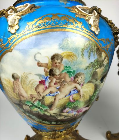 null SEVRES (in the taste of) A pair of blue and gold porcelain covered perfume burners...