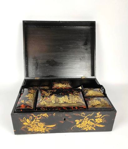 null A lacquered wood box with chinoiserie decoration containing eight small boxes...