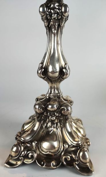 null A silver baluster candlestick with foliage decoration. Goldsmith : M. JARRA...