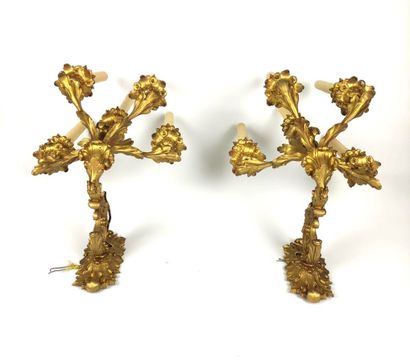 null Pair of ormolu and chased sconces with foliage decorations holding five arms...