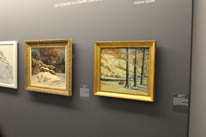 null GUSTAVE COURBET (1819-1877)  Deux chevreuils au repos dans un paysage de neige...