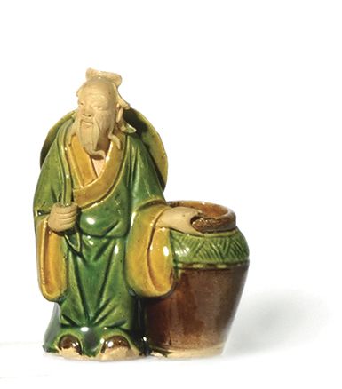 null A SET OF FIVE yellow, green and aubergine glazed ceramic SUBJECTS, called "Shiwan...