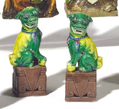 null A SET OF FIVE yellow, green and aubergine glazed ceramic SUBJECTS, called "Shiwan...