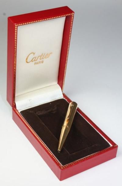 CARTIER Porte mine Cartier, en or jaune, dans sa boite d'origine. Poids brut: 16,1...