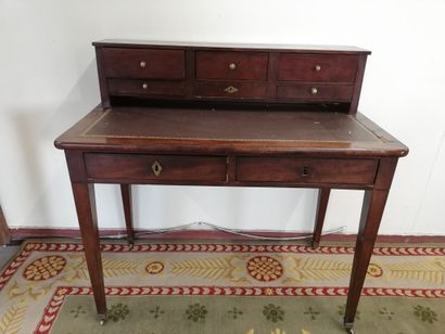 Mahogany veneer stepped desk opening with...