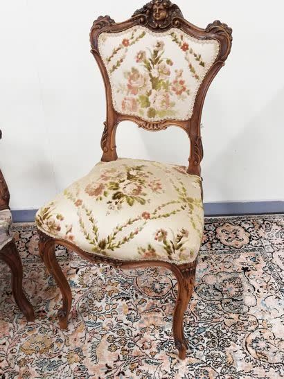 null An armchair and a chair in carved wood 

Louis XV style

Around 1900

Upholstery...