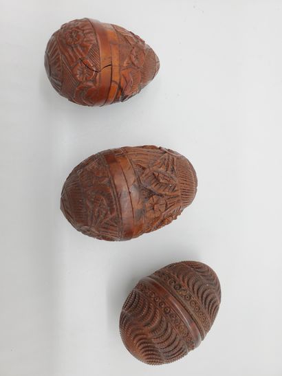 THREE EGG BOXES in corozo carved with floral...