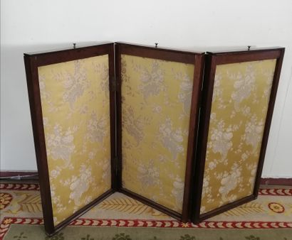 null Three-leaf mahogany veneer system screen with floral fabric on a yellow background...