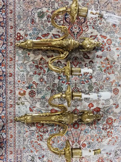 null Pair of gilded bronze wall lights with two arms of light and decoration of fire...