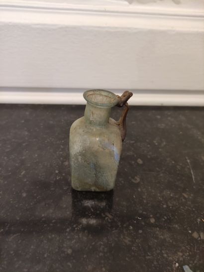  Bottle with cubic body and handle with poucier. Greenish and partially iridescent...