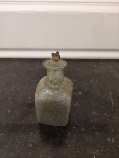  Bottle with cubic body and handle with poucier. Greenish and partially iridescent...