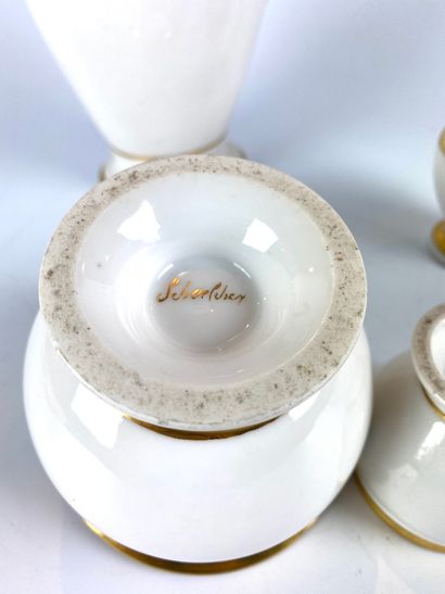 null 
PARIS

 Part of a white and gold porcelain chocolate service, including :

-A...