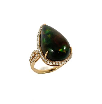 RING adorned with a black pear-shaped opal...