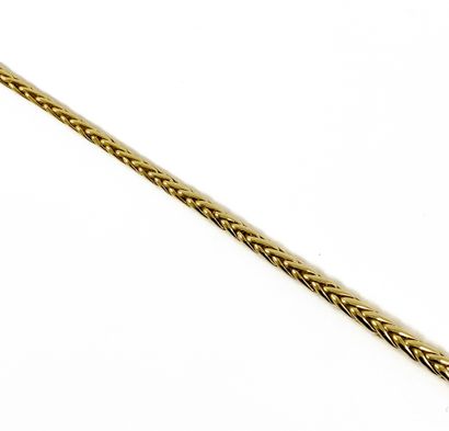 null NECKLACE adorned with a herringbone link. Mounting in 18K yellow gold. French...