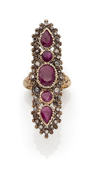 null RING composed of an oval ruby with two round rubies and two pears in a setting...