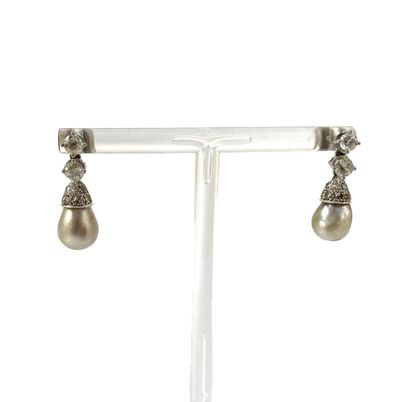 null PAIR OF EARRINGS holding a pear-shaped gray pearl (untested) held by a cap paved...