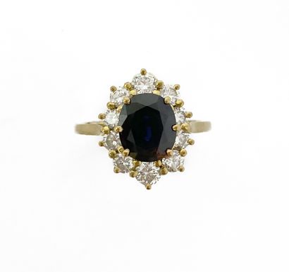 null MARGUERITE RING holding a sapphire of approximately 2.20 carats in a surround...