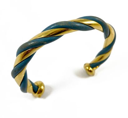 null HERMÈS BRACELET JONC adorned with a interlace made of navy blue leather and...