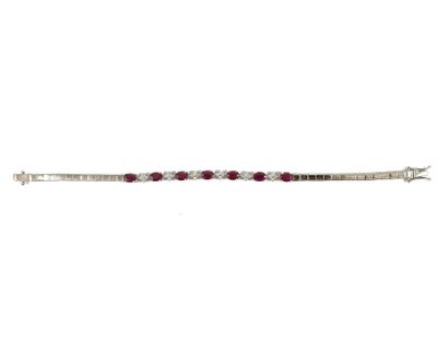 BRACELET holding a succession of oval rubies...