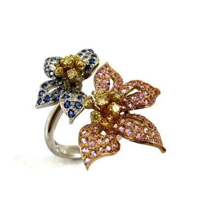 null RING composed of two flowers adorned with pink and blue sapphires with yellow...
