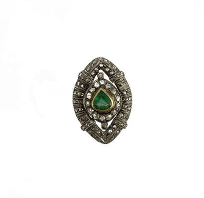 null RING holding a pear-shaped emerald in a shuttle design punctuated with rose-cut...