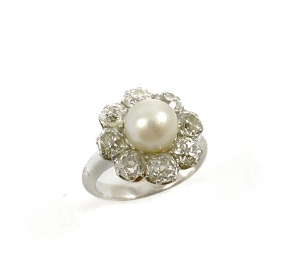 null RING adorned with a flower with a white pearl (untested) in its center in a...