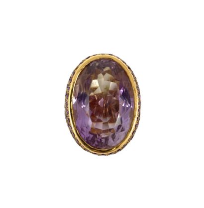 null IMPORTANT RING holding an amethyst of approximately 30 carats in a pavement...