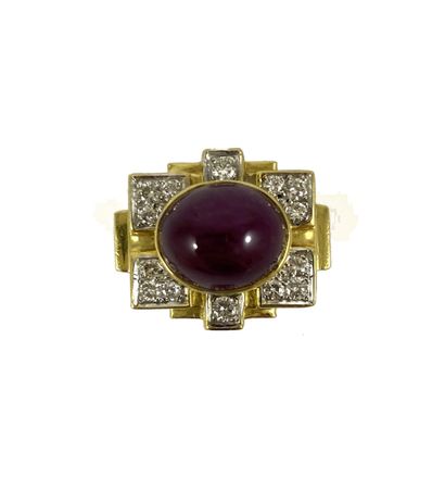 null 1940's RING holding a cabochon of ruby in a geometric setting paved with brilliant-cut...
