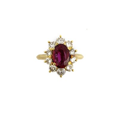 null POMPADOUR RING holding a ruby of about 1.50 carats in a circle of brilliant-cut...
